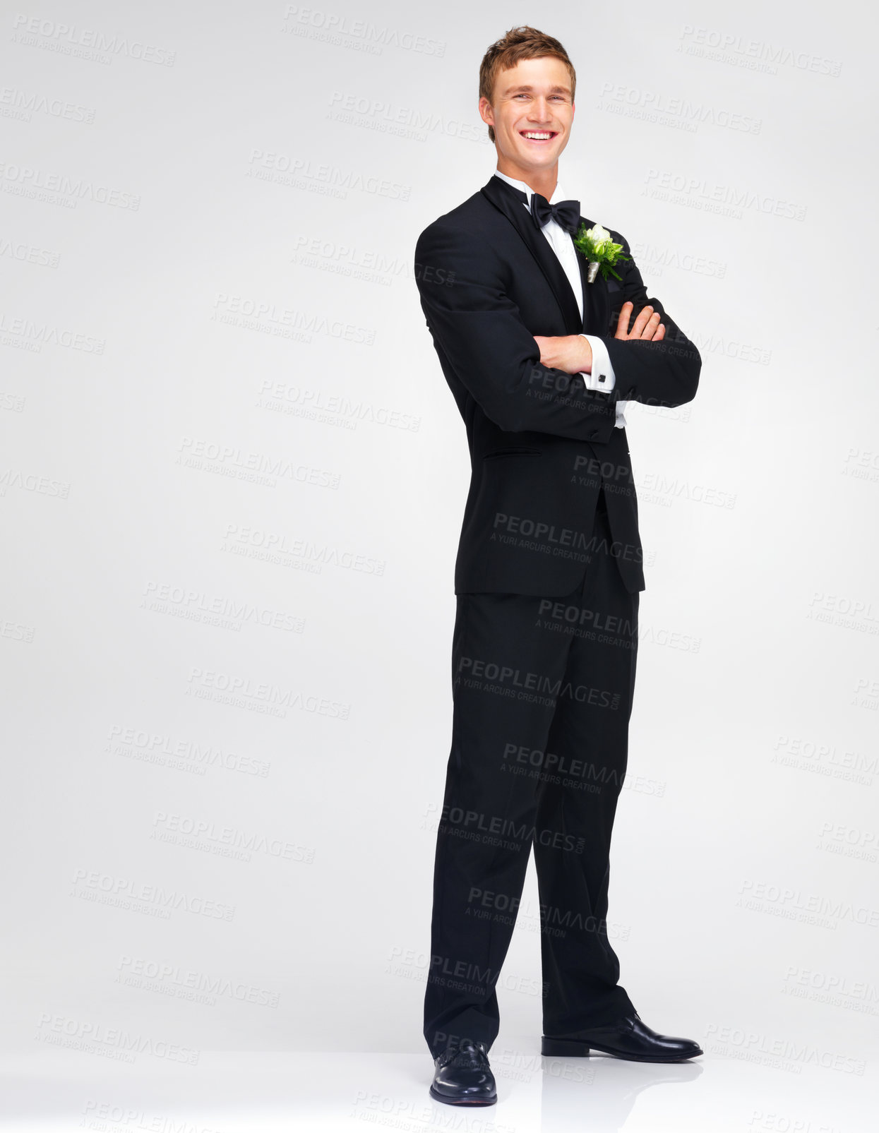 Buy stock photo Wedding, marriage and groom with a handsome man standing arms crossed in studio against a white background. Happy male in a suit or tuxedo with a smile ready to get married at a celebration event