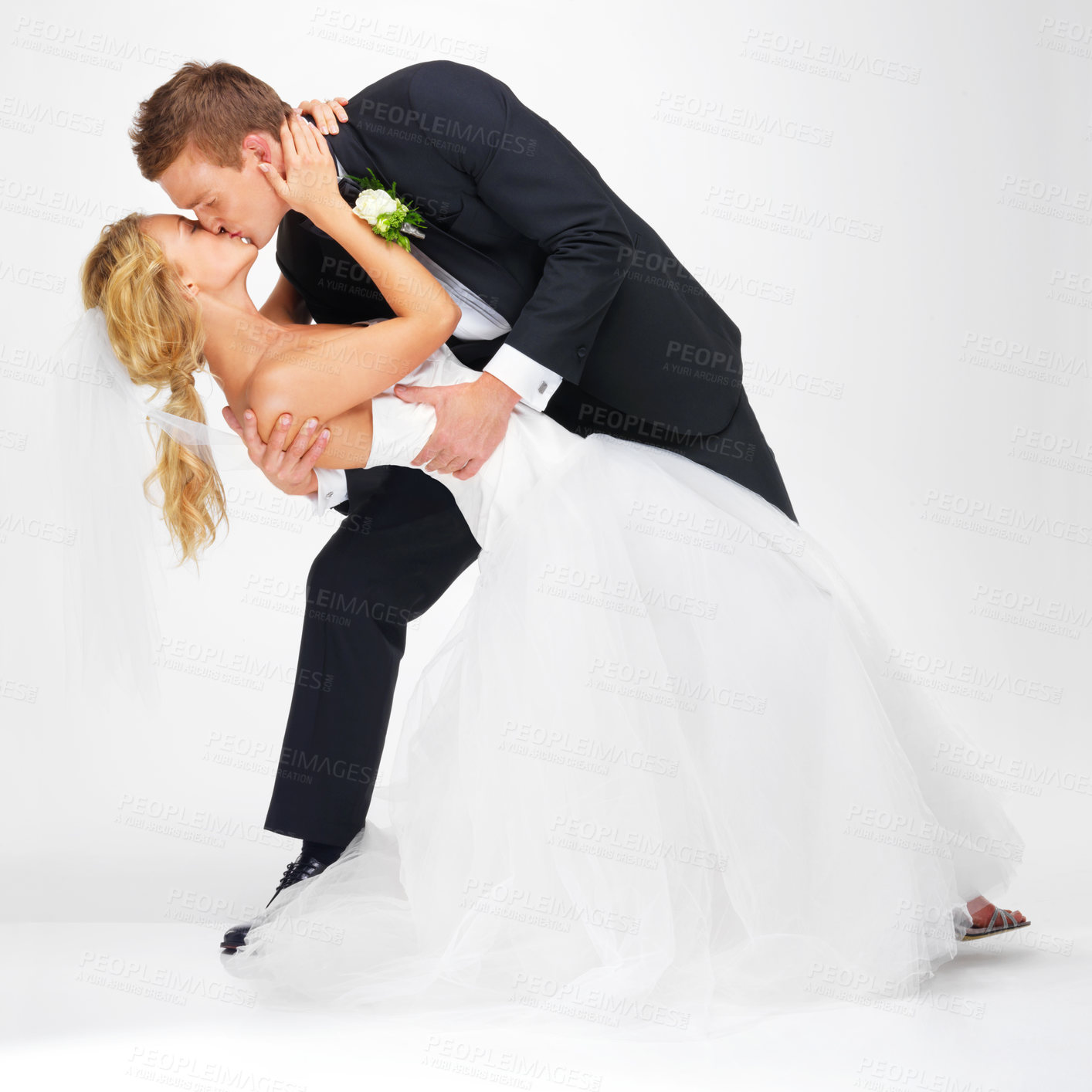 Buy stock photo Wedding, couple and love with a kissing  man and woman after marriage in studio on a white background. Young bride and groom at a celebration event together, happy and romantic in a dress and suit