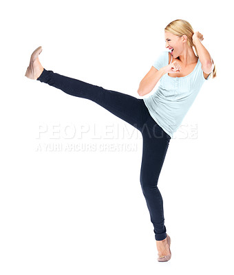 Buy stock photo Woman, fight and kick a leg in air with karate, action or movement on white background in studio. Foot, kicking and person in self defence training, class or fighter with energy for attack move