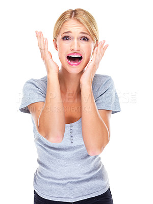 Buy stock photo Studio portrait of a young woman looking afraid against a white background