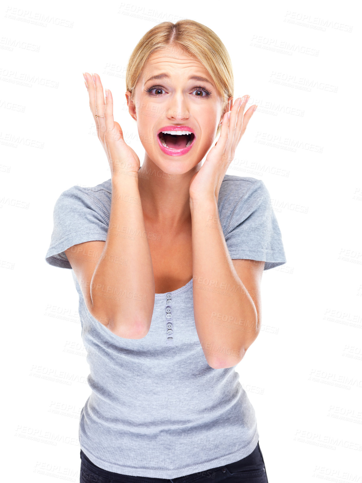 Buy stock photo Studio portrait of a young woman looking afraid against a white background