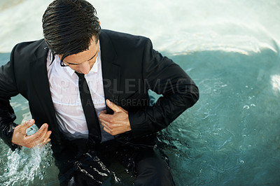 Buy stock photo Water, pool and a business man in debt during depression of the economy or financial crisis. Finance, challenge and unemployment with a young corporate employee wet in a suit during recession