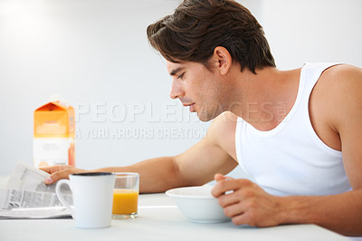 Buy stock photo Home, relax and man with breakfast, newspaper and information with food, smile and juice. Happy person, apartment and guy with health, morning meal and kitchen with newsletter, wellness and reading
