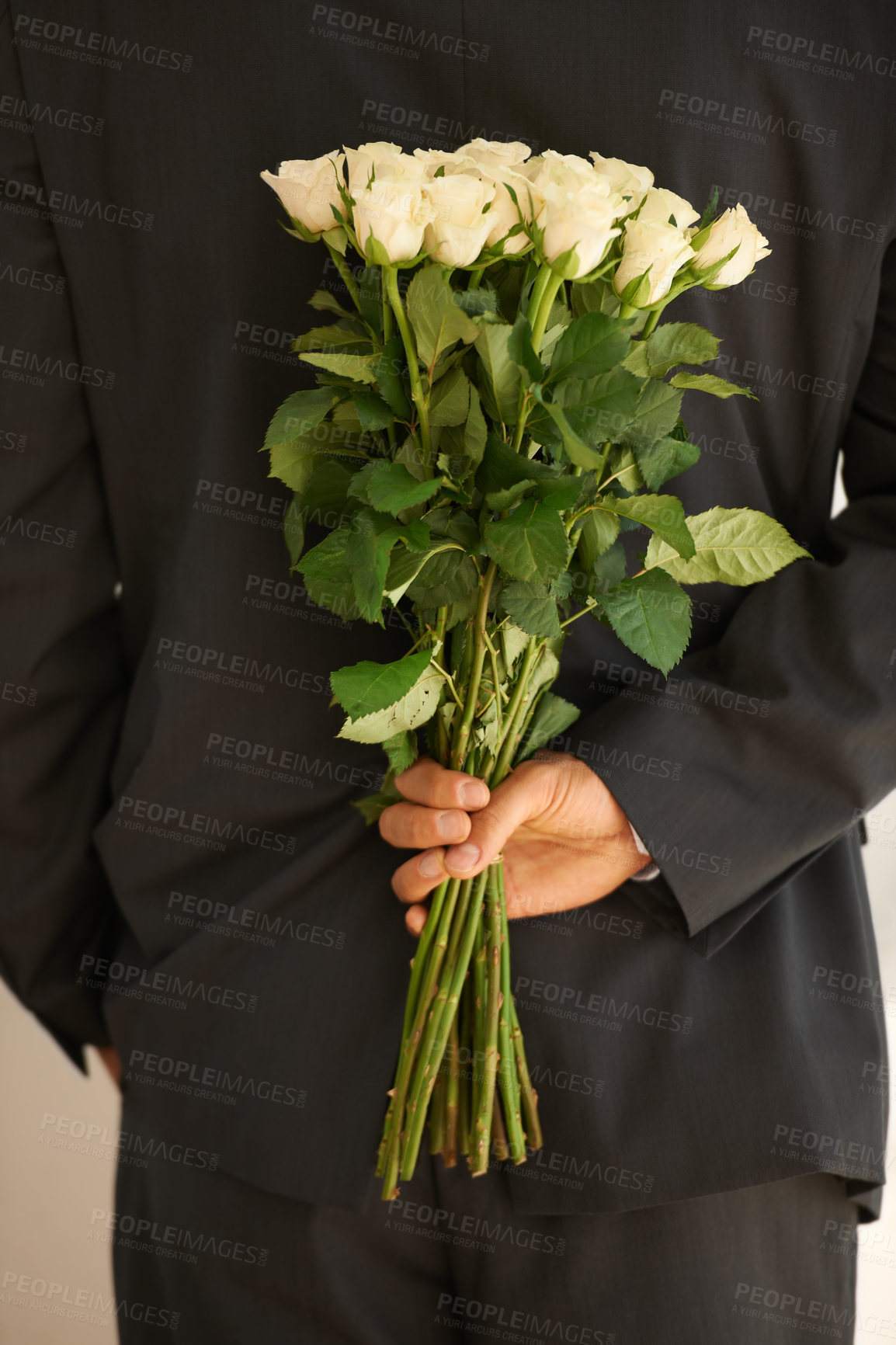 Buy stock photo Rose bouquet, behind back and in hand of person, surprise and gift with special time, anniversary or birthday. Romance, celebration and flowers, nature and secret present with date and event