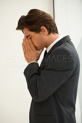 Buy stock photo Stress, anxiety and business man in office with fear, worry or desperate prayer for help on wall background. Nervous, mistake and profile of male manager with headache for startup, disaster or fail