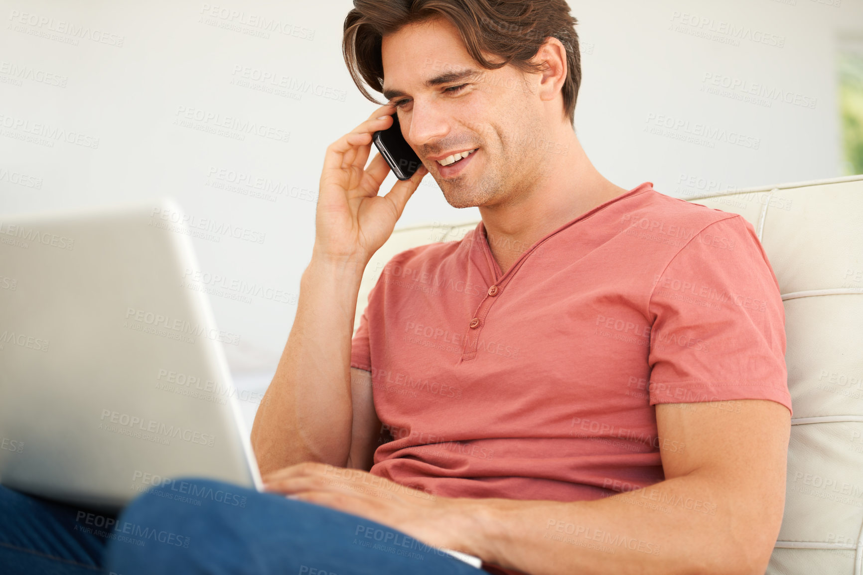 Buy stock photo Phone call, laptop and young man in discussion for communication with technology at home. Happy, networking and male person from Canada on mobile conversation with cellphone and computer at apartment