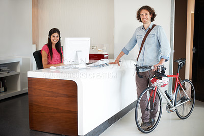 Buy stock photo Man, office with bike and sustainable travel, worker in portrait with carbon footprint, transportation and creative at startup. Happy, cycling for eco friendly commute and professional at workplace