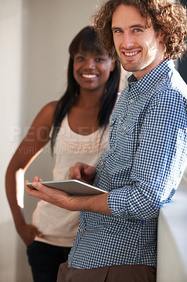 Buy stock photo Portrait of happy employee working on a tablet in the office balcony while planning a strategy together. Diversity teamwork, support and collaboration make worker smile at a startup company office