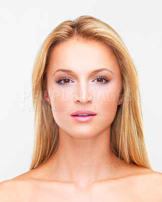 Buy stock photo Portrait of a beautiful blonde woman with flawless skin gazing at you, isolated on white