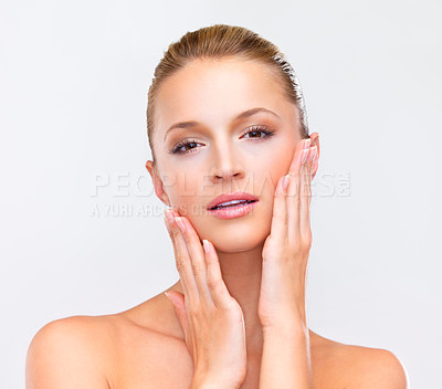 Buy stock photo Woman, portrait and touch face for beauty, skincare and collagen results in studio on white background. Young model, healthy facial glow and wellness for dermatology, cosmetics and aesthetic shine