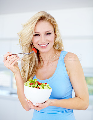 Buy stock photo Portrait of a gorgeous young woman eating a healthy salad