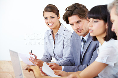Buy stock photo Business people, laptop and meeting with paperwork in strategy, marketing or collaboration at the office. Group of employees working together on computer in teamwork or brainstorming at the workplace