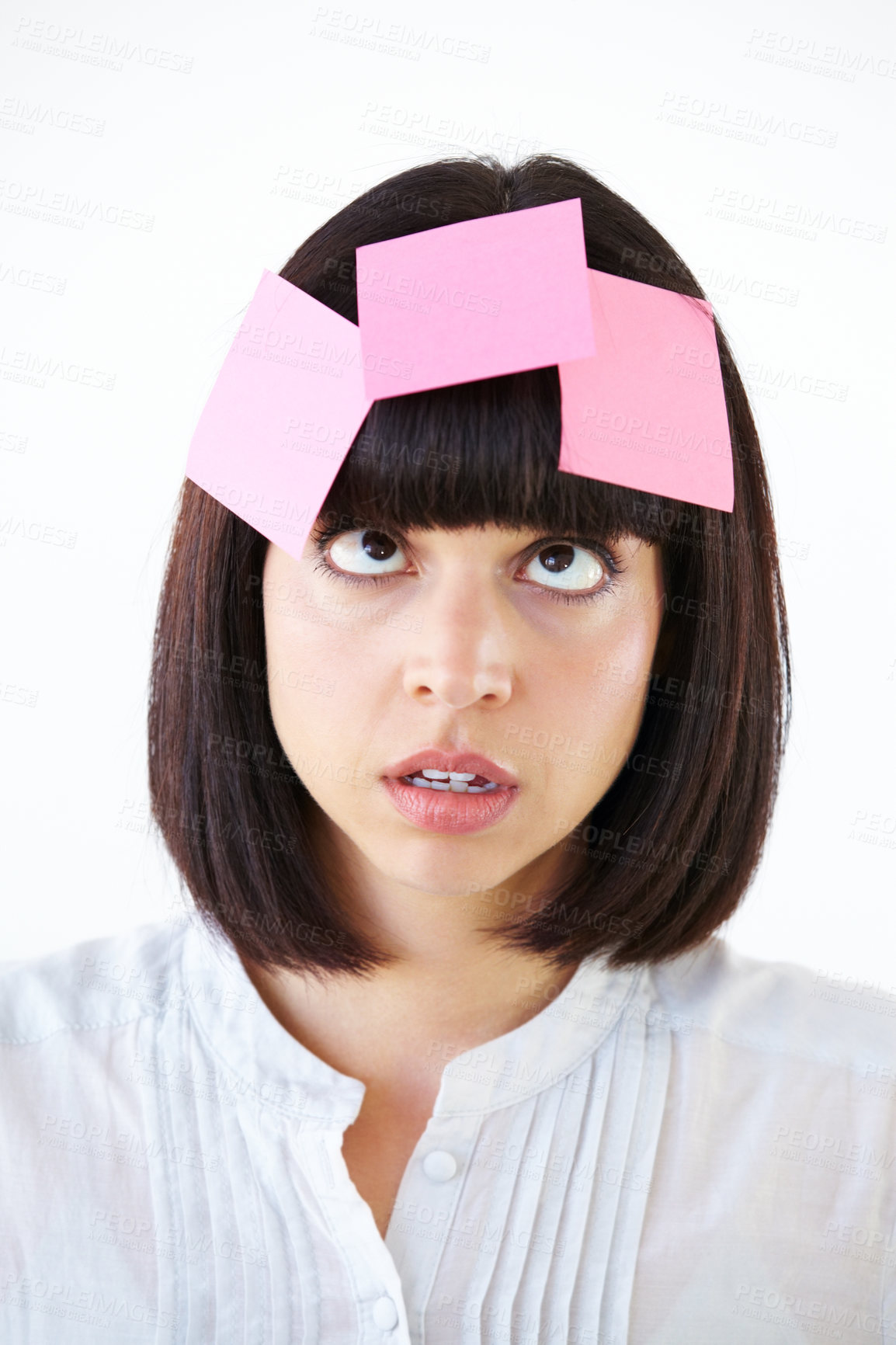 Buy stock photo Stress, sticky note and the head of a business woman in studio isolated on a white background with a to do list. Face, thinking and confused with a young employee in doubt about a task closeup