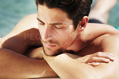 Buy stock photo Sleeping, tanning and a man in the sun to relax, swimming or thinking on a vacation. Calm, summer and a young person enjoying peace, break or pool in Greece on a holiday with an idea in the water
