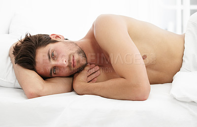 Buy stock photo Sexy portrait, man in bed and morning wake up time with sensual pose, relax and rest in apartment. Sleep, relaxing and handsome, tired topless male model with muscle waking in bright bedroom of home.