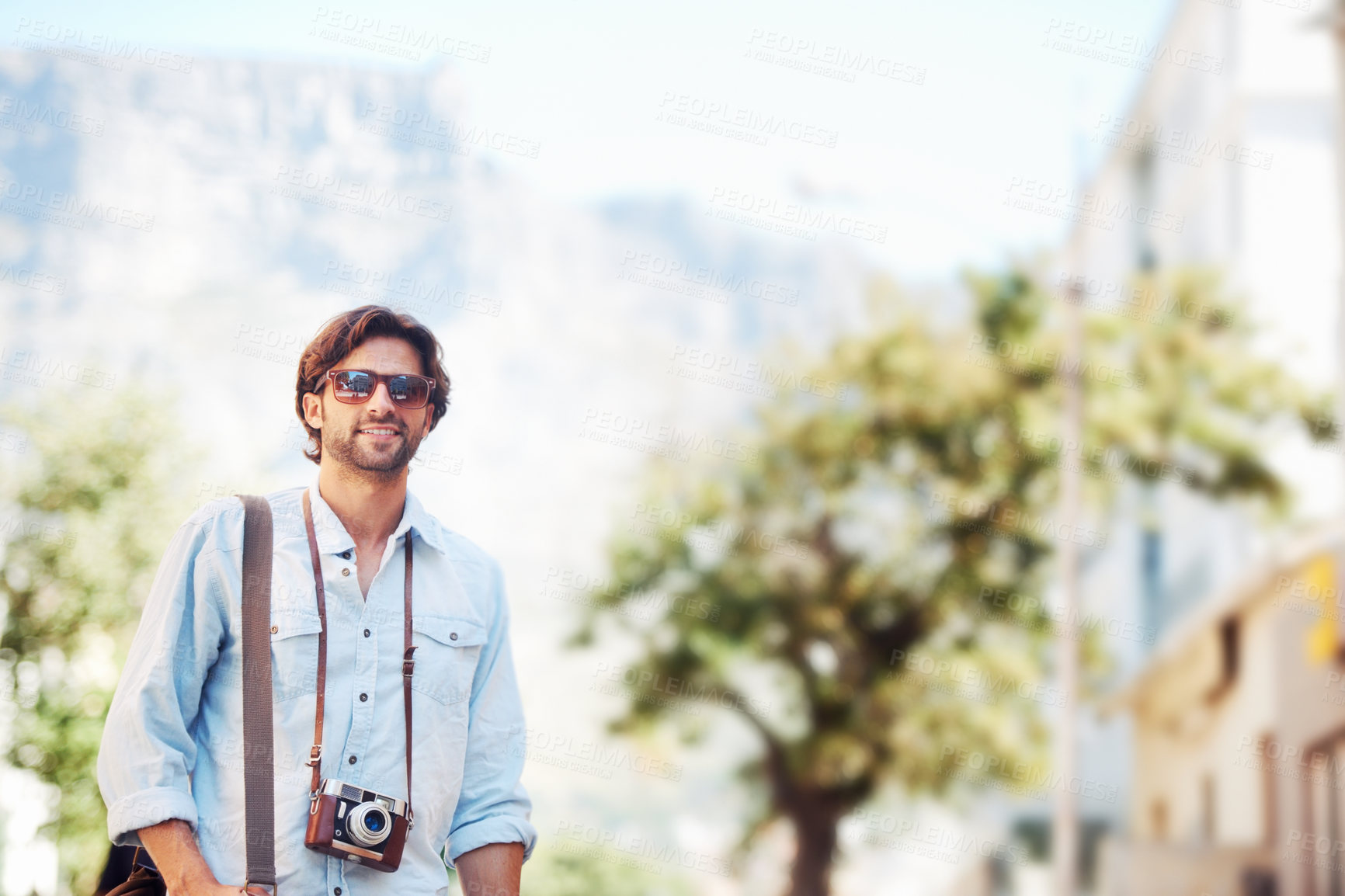 Buy stock photo Photographer, happy man or tourist on holiday, vacation or trip for a fun adventure in Italy with sunglasses. Summer mockup space, travel or person for camera or freedom sightseeing in nature journey