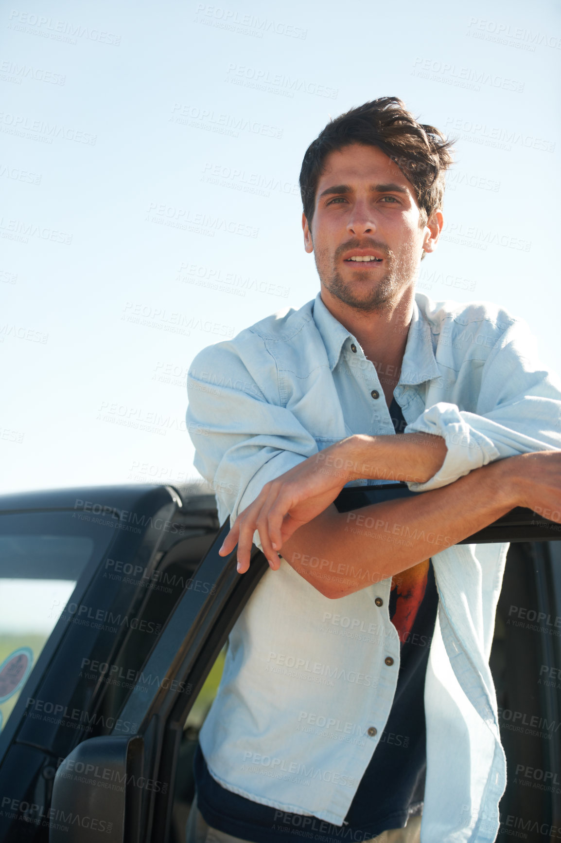 Buy stock photo Freedom, portrait and man in car on road trip at door, travel and desert adventure for summer vacation. Transport, holiday journey and calm person standing at van in nature, sunshine and countryside.