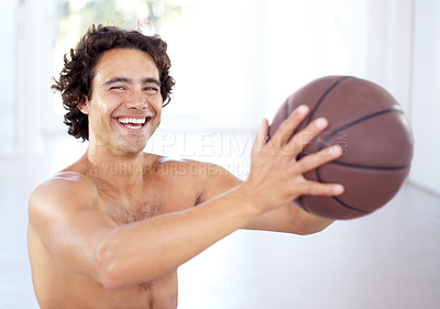 Buy stock photo Portrait of a sexy young man holding a basketball