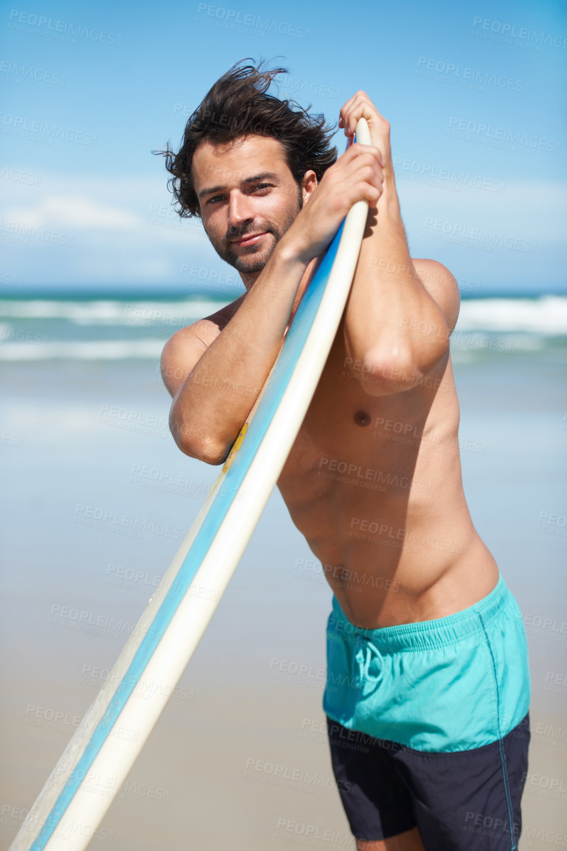 Buy stock photo Portrait, surf and a man in the ocean at the beach for surfing while on summer holiday or vacation. Surfboard, body and windy with a young male surfer shirtless outdoor by the sea for a sports hobby