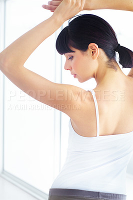 Buy stock photo Woman in home stretching arms, back or body in workout for fitness performance or spine flexibility. Girl athlete, morning or start of training in studio for wellness, health and exercise in warm up 