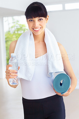 Buy stock photo Portrait, yoga and woman with a water bottle, exercise and challenge with hydration, towel and sports. Person, healthy girl or athlete with liquid, smile or workout with training, thirsty or wellness
