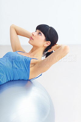 Buy stock photo Woman, exercise ball and back for pilates, exercise or workout on muscle, posture and healthy body. Person, arm or stretching for yoga, training or fitness with sportswear and technique in studio
