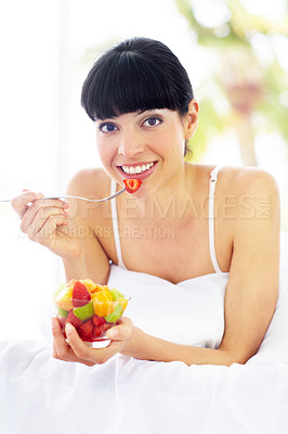 Buy stock photo Fruit salad, home bed and portrait of happy woman with organic meal, snack or morning breakfast for healthy lifestyle balance. Apartment bedroom, strawberry benefits or relax person eating vegan food