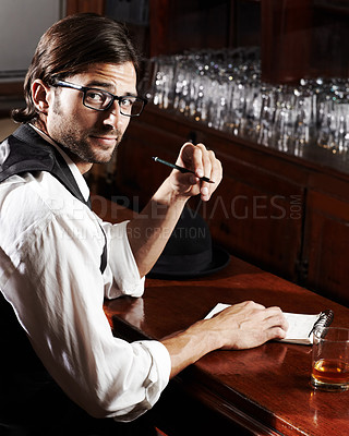 Buy stock photo Portrait, writer and man with a notebook, whiskey and creativity with inspiration, journalist and glasses. Face, person and author with alcohol, ideas and writing in a tavern, poet and freelancer