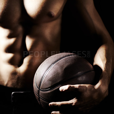 Buy stock photo Muscle, body and hands of athlete with basketball in studio isolated on a black background. Sports, closeup and strong man with ball, abs and workout for fitness, training or exercise for health