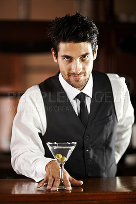 Buy stock photo Man, portrait and giving cocktail at bar for service, drink and welcome to party, club or event. Male server, barman or waiter with glass for alcohol, spirit or mixer with presentation at restaurant