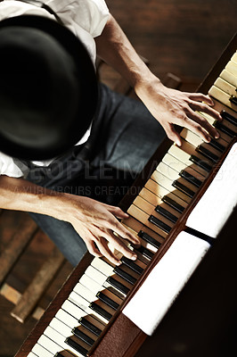 Buy stock photo High-angle view of a young musician playing the piano