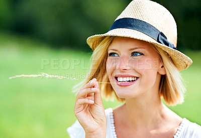 Buy stock photo Woman, smile and wheat in mouth, nature and sustainability in harvest, natural and whole grains in environment. Happy person, rye and grain snack in outdoor adventure, travel and journey in summer