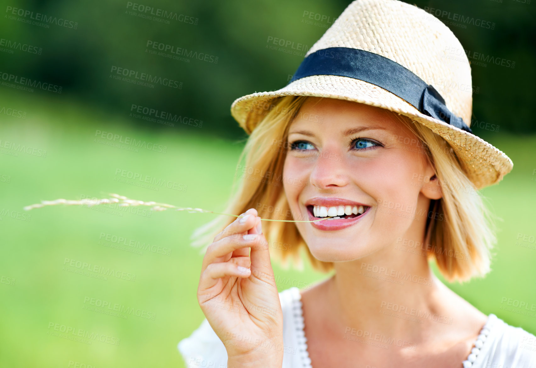 Buy stock photo Woman, smile and wheat in mouth, nature and sustainability in harvest, natural and whole grains in environment. Happy person, rye and grain snack in outdoor adventure, travel and journey in summer