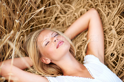 Buy stock photo Relax, sleeping and calm woman lying on a grass with freedom, peaceful and chilling in nature. Eyes closed, nap and female in New Zealand in a wheat field for travel, vacation or countryside trip 