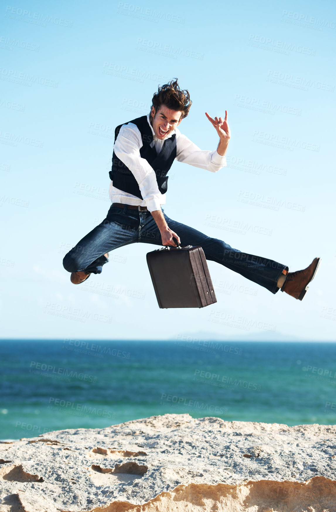Buy stock photo Portrait, ocean and jump with man, briefcase and excited with happiness, holiday and business. Person, employee and consultant with seaside background, beach and action with celebration and vacation