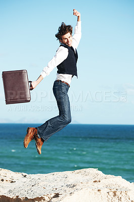 Buy stock photo Portrait, ocean and jump with man, briefcase and achievement with happiness, celebration and business. Person, employee and consultant with seaside background, beach and action with vacation or break