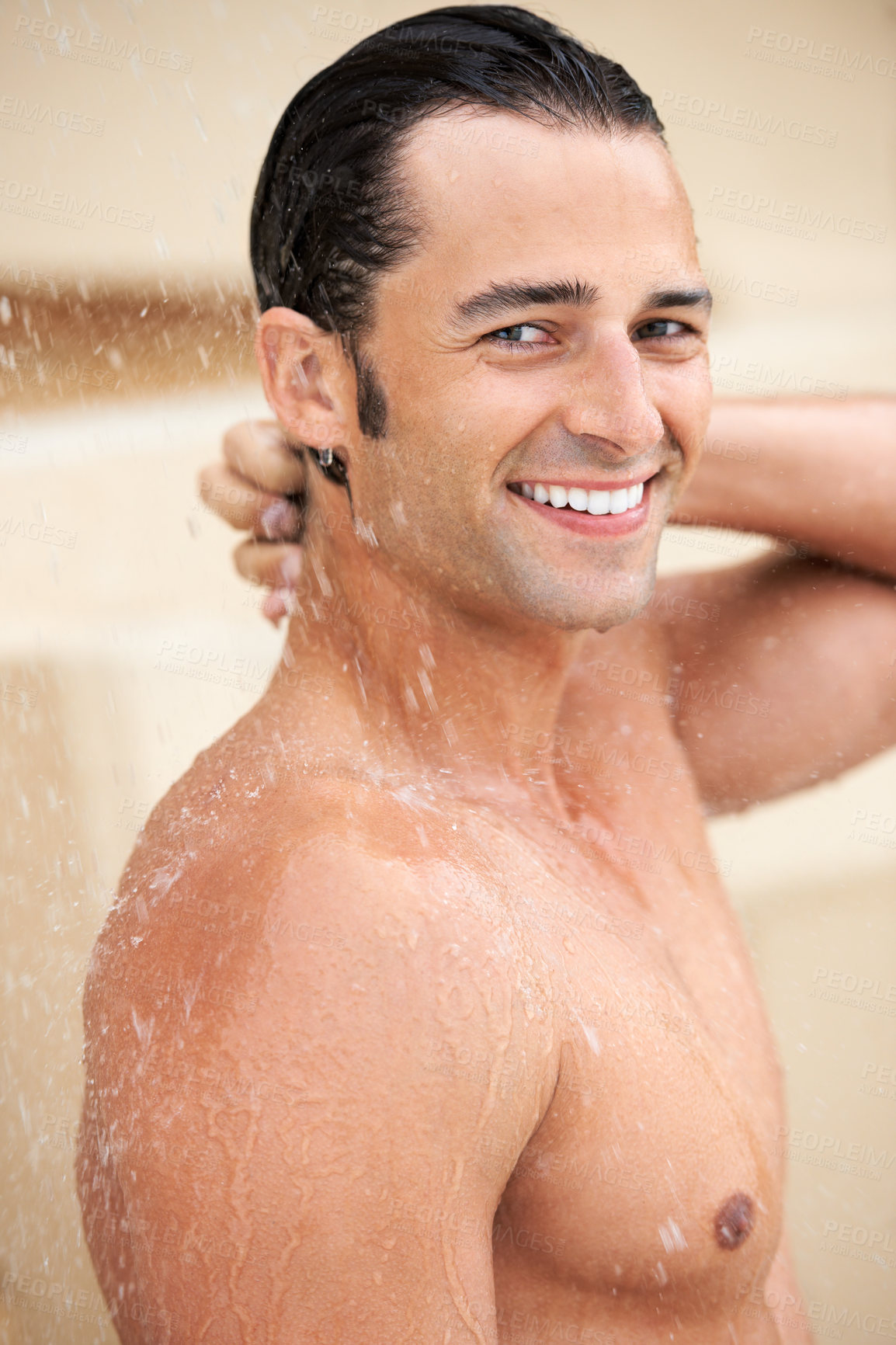 Buy stock photo Man, shower and water drop with smile, portrait and bathroom for hygiene, self care and morning for skin routine. Young guy, body cleaning and healthy for skincare, wellness or happiness in apartment