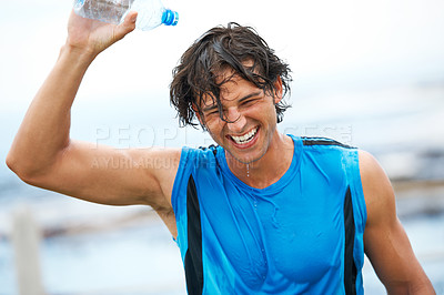 Buy stock photo Man, fitness and pouring water on head for health, laughing and fun in cardio training. Happy male athlete, liquid and refreshment from exercise, workout and running by ocean, sea and outdoor play