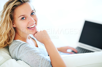 Buy stock photo Laptop, portrait and smile of woman on sofa in home, typing email or mockup space. Computer, happy and face of person or girl in living room on social media, website or communication on tech to relax
