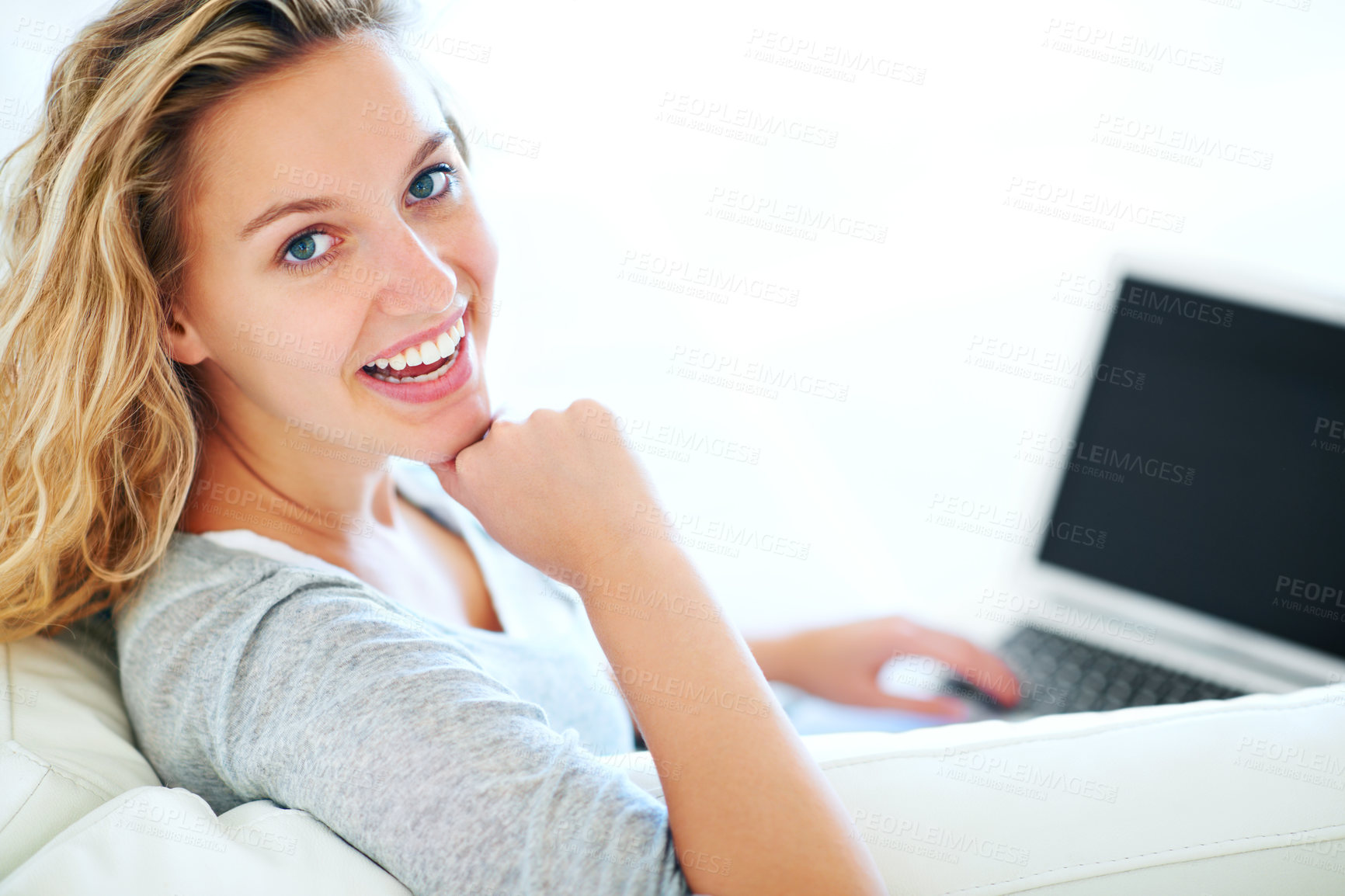 Buy stock photo Laptop, portrait and smile of woman on sofa in home, typing email or mockup space. Computer, happy and face of person or girl in living room on social media, website or communication on tech to relax