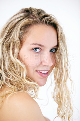 Buy stock photo A natural blonde beauty looking at you coyly while isolated on white