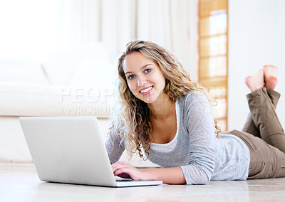 Buy stock photo Laptop, portrait and happy woman on floor in home, typing email and network on internet. Computer, smile and face of girl in living room on social media, website and communication on tech to relax