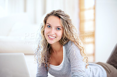 Buy stock photo Laptop, smile and portrait of woman on floor in home, typing email and network on internet. Computer, happy face and girl in living room on social media, website and communication on tech to relax