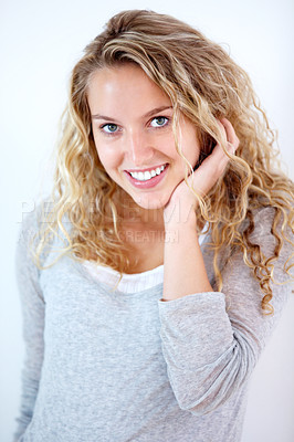 Buy stock photo Portrait of a pretty young blonde smiling at you sweetly
