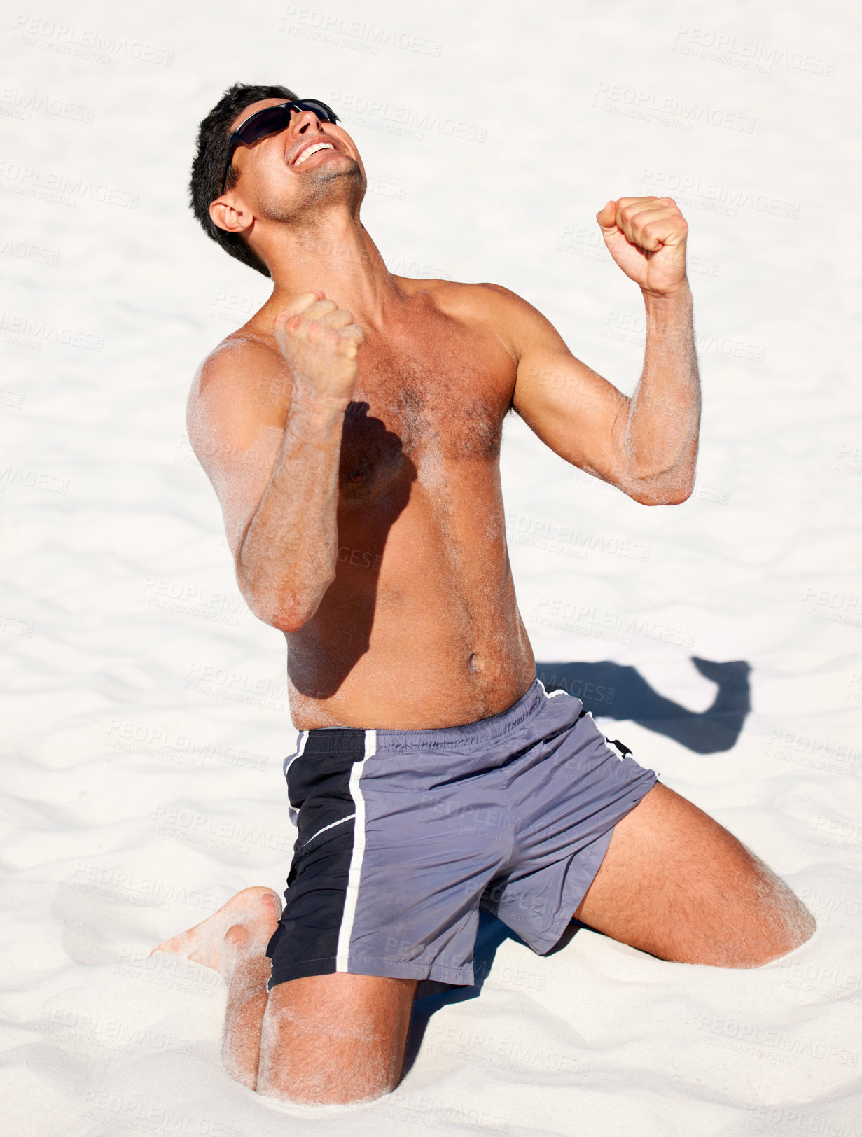 Buy stock photo Beach, celebration and fitness man with winner fist in sand for exercise, success or growth milestone. Freedom, energy and excited athlete in nature with sports achievement, victory or training win