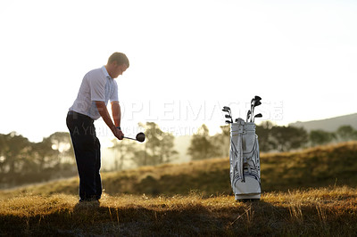 Buy stock photo Golf, stroke and man with driver outdoor on course for training, workout or fitness at sunset mockup space. Golfing, club and person swinging for game, competition or exercise, sports and wellness.