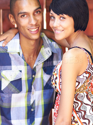 Buy stock photo Portrait of a loving young couple standing together indoors