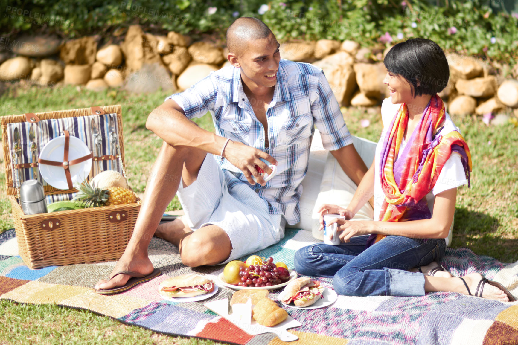 Buy stock photo Happy, couple and picnic park love for romance eat, food basket for sun smile celebration. Man, woman and outdoor summer diet or fruit eating vacation holiday lunch or connection, meal date on grass