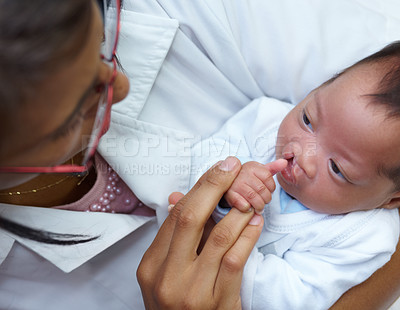 Buy stock photo Healthcare, cleft lip and a pediatrician with a baby in the hospital for insurance, care or treatment. Medical, children and a doctor woman holding a newborn with a disability in a health clinic