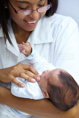 Buy stock photo Healthcare, smile and a pediatrician with a baby in the hospital for insurance, care or treatment. Medical, children and a happy doctor woman in glasses holding a newborn infant in a health clinic